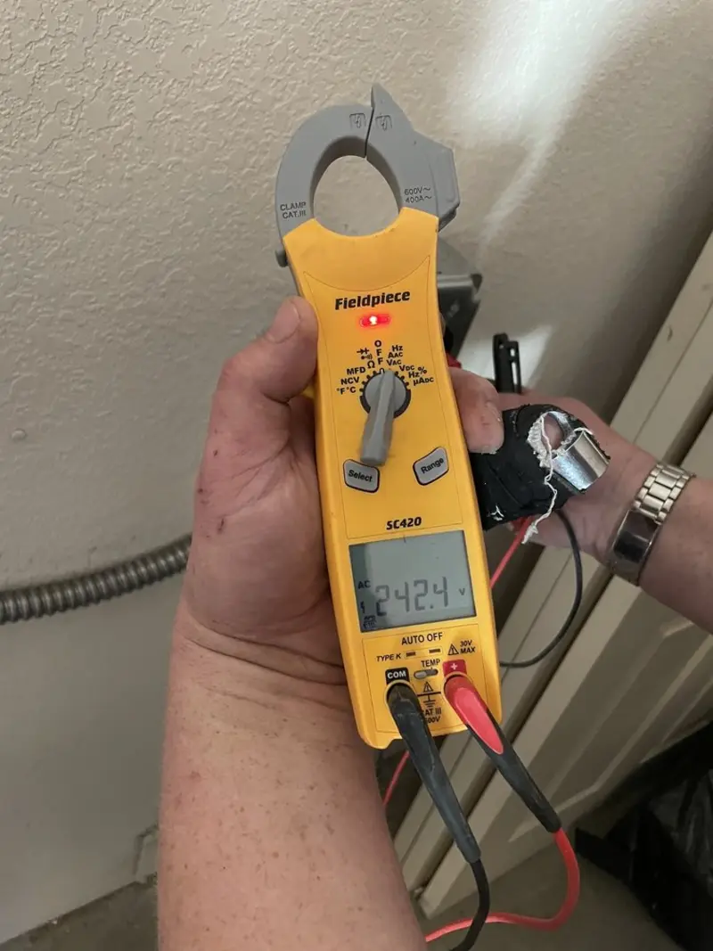 Voltage testing with clamp meter during Outlet Installation in Coopertown